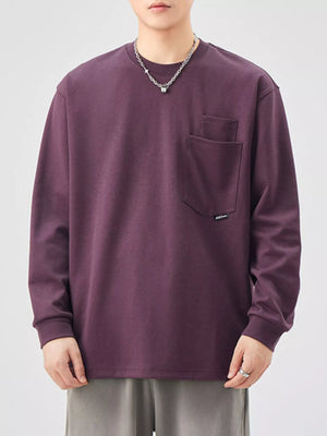 Casual oversized long-sleeve sweatshirt in Sauce Purple with a chest pocket.