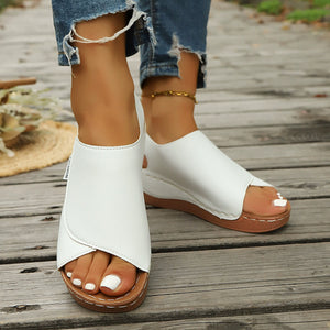 White open-toe wedge sandals with a casual chic design and comfortable fit.