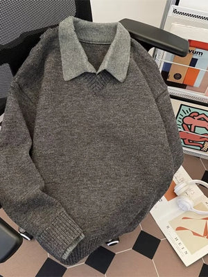 Gray ribbed hem long-sleeve sweater with a contrasting collar and V-neck.