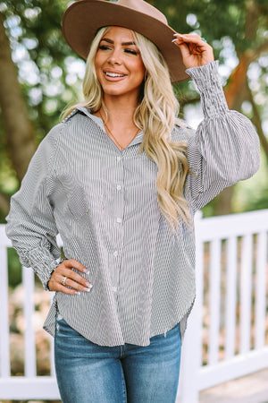 Pinstripe blouse with balloon sleeves and smocked cuffs.
