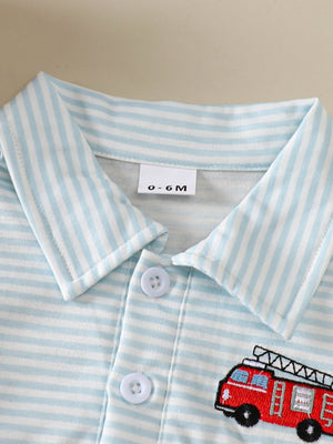 Baby polo shirt with blue and white stripes and embroidered firetruck detail.
