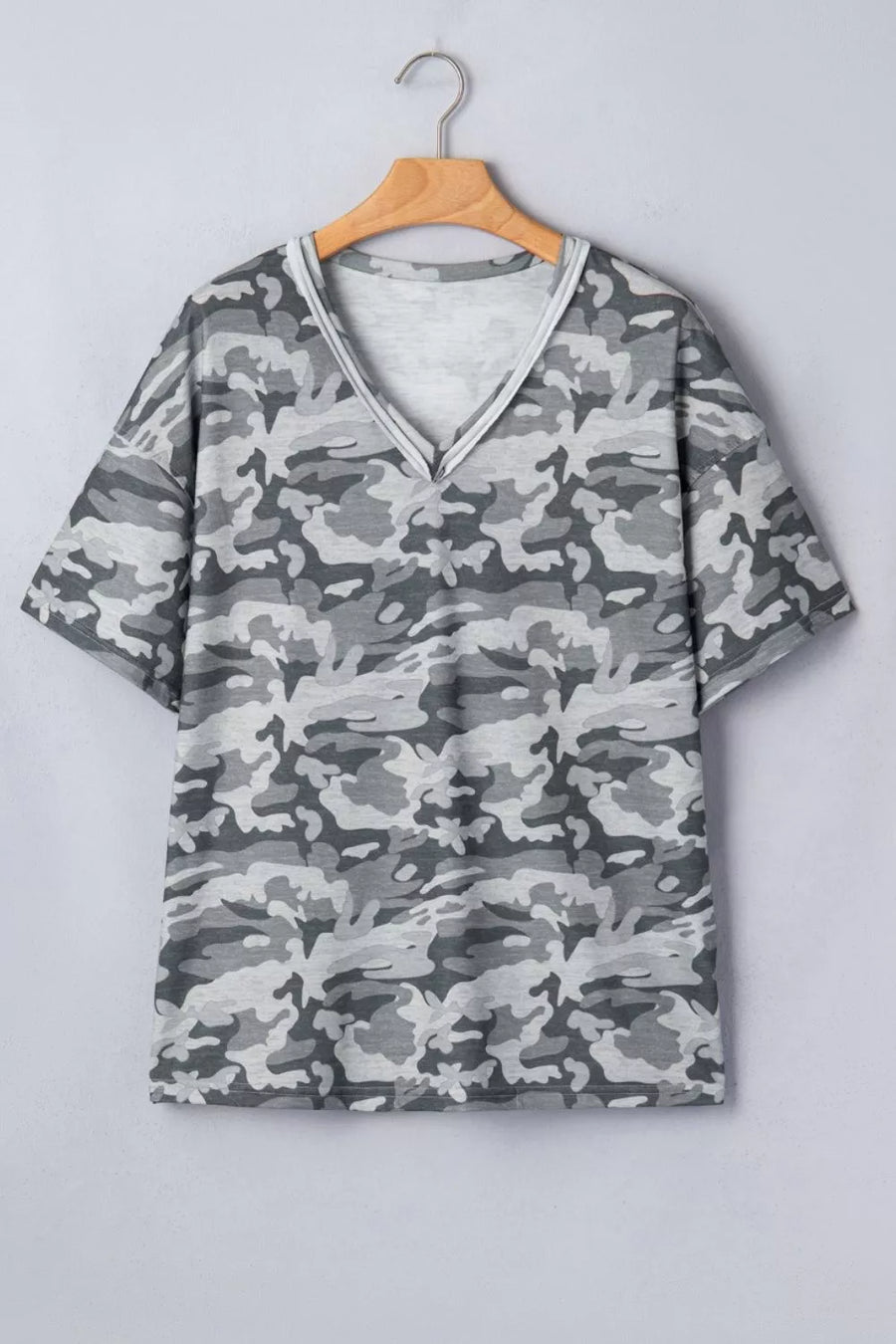 Camouflage v-neck relaxed tee with short sleeves and a grey camo print.