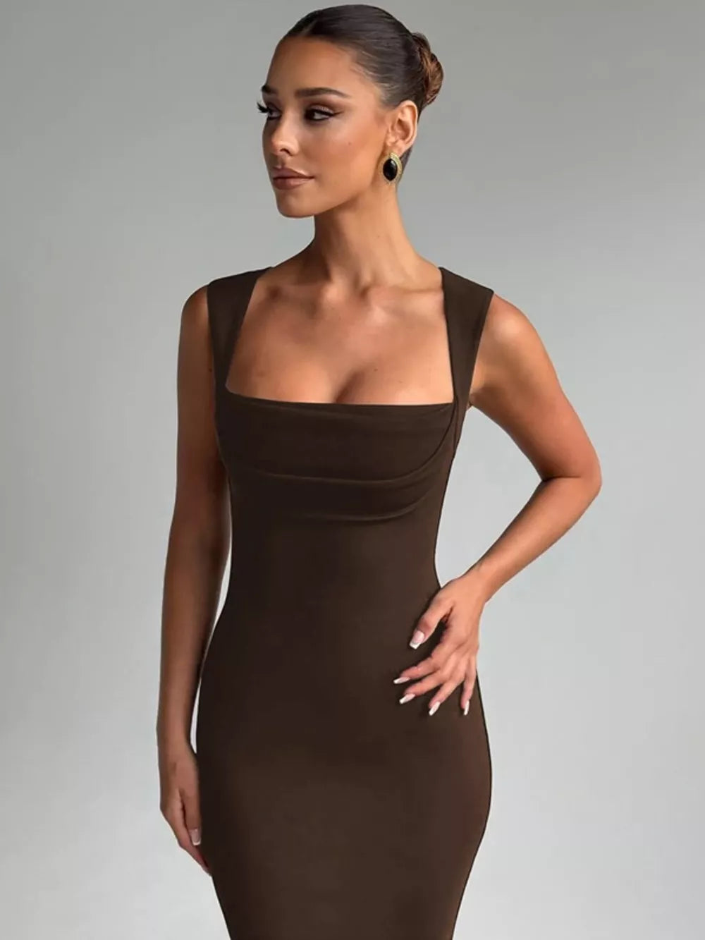 Brown bodycon maxi dress with square neckline and sleeveless cut.