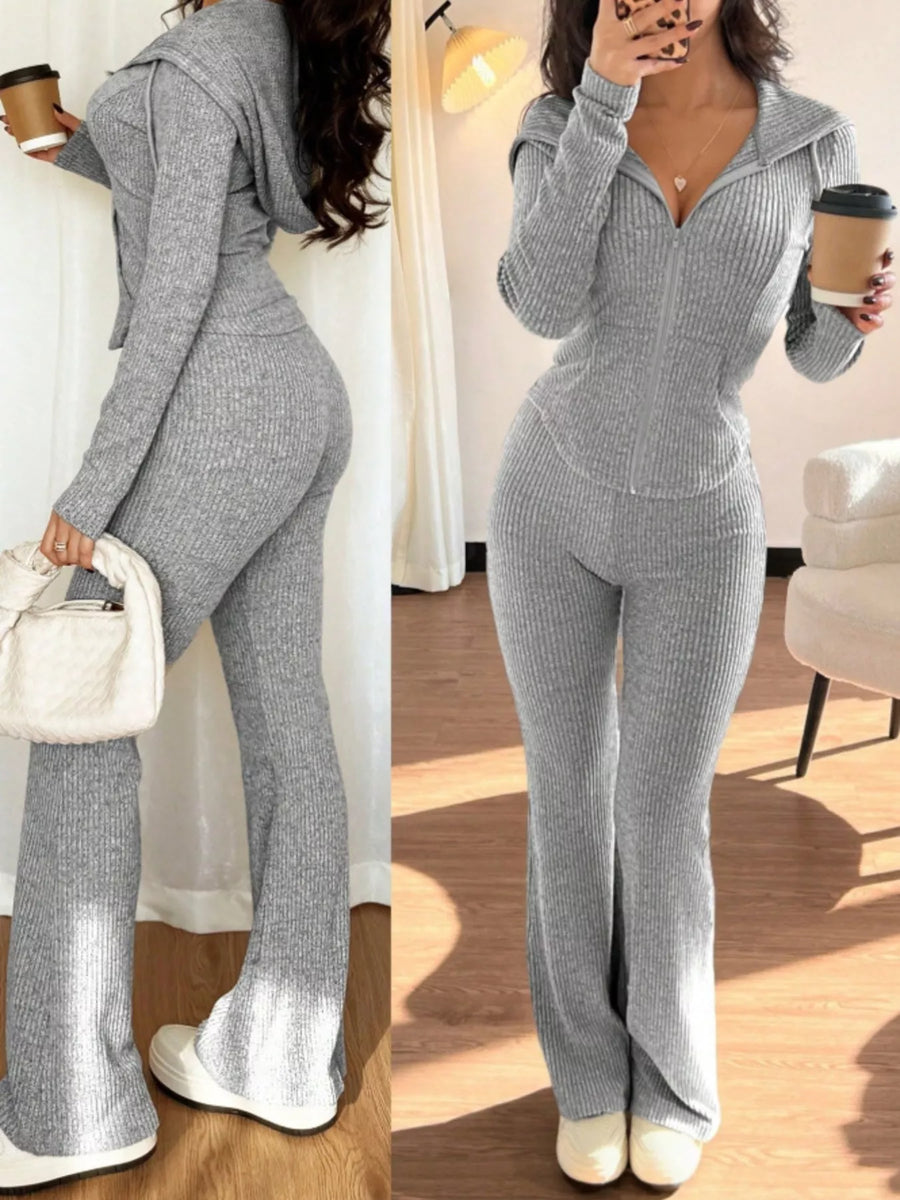 Light gray ribbed zip-up hooded set with flared pants.