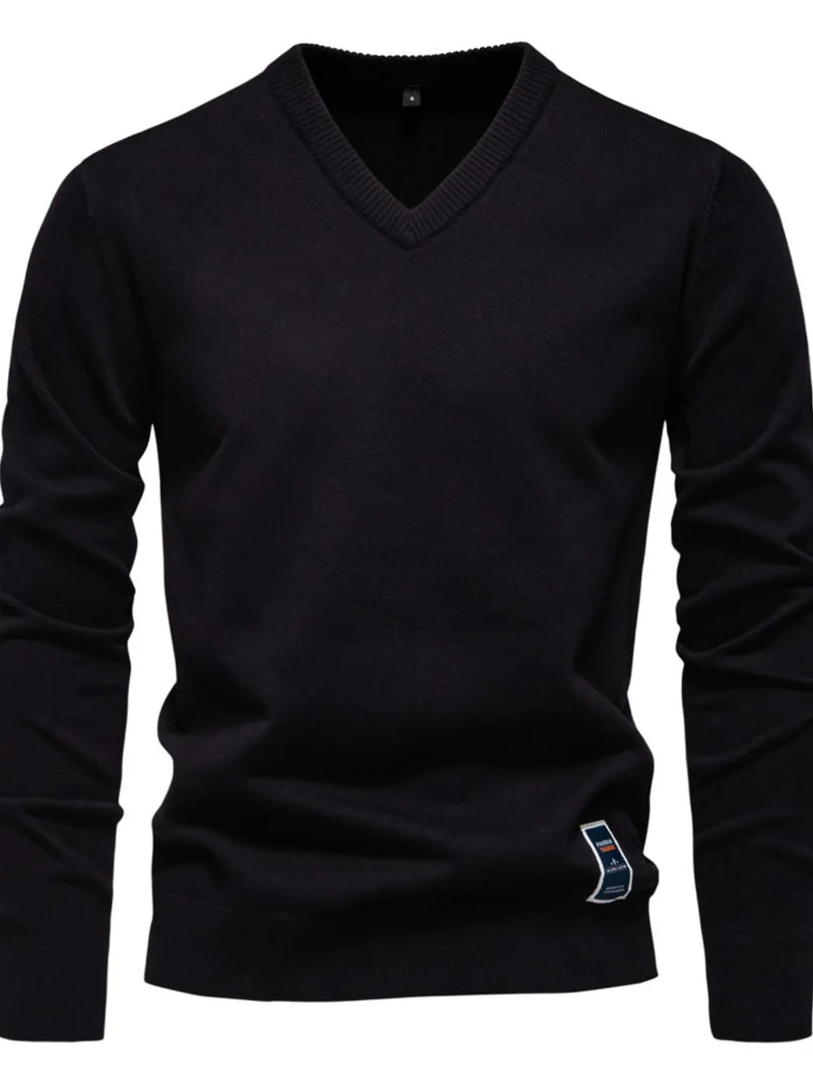 Black V-neck ribbed knit sweater with long sleeves and a small logo tag detail.