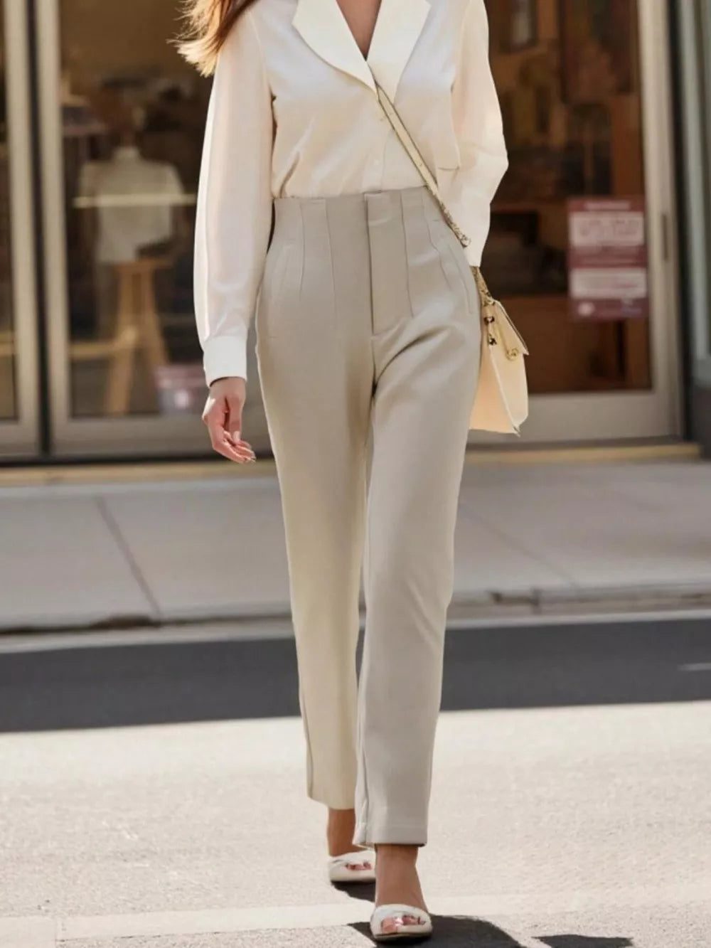 Elevated high-waisted straight-leg pants in beige, featuring a tailored fit and subtle seam details.