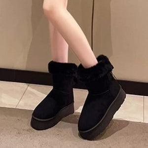 Black suede round-toe boots with fur trim and platform sole