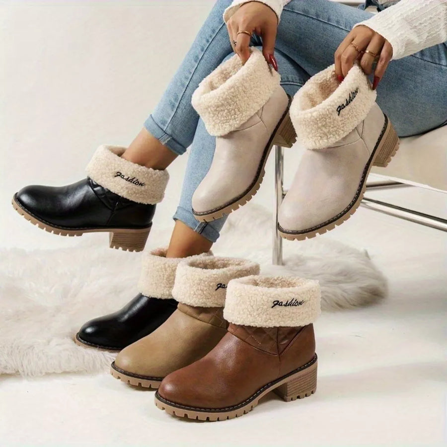 boots in black featuring round toe and regular fit