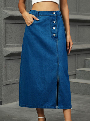 Button-front denim A-line skirt in medium blue with a front slit and pockets.