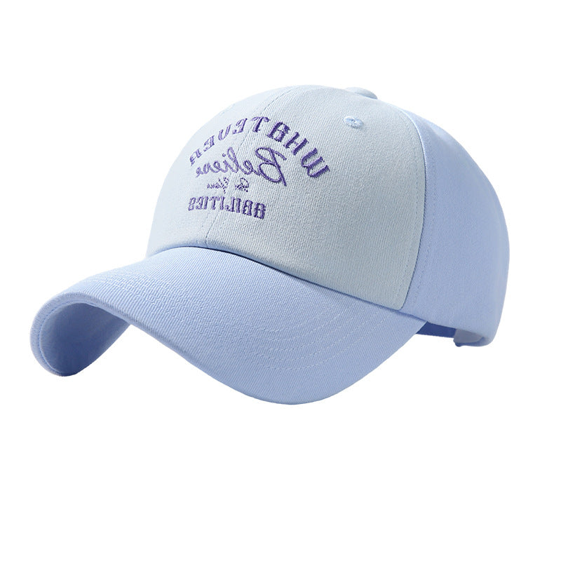 Two-tone baseball cap in sky blue and light blue with purple embroidery.
