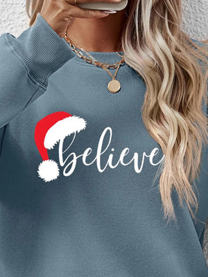 Light Blue raglan sweatshirt with "Believe" text and Santa hat graphic