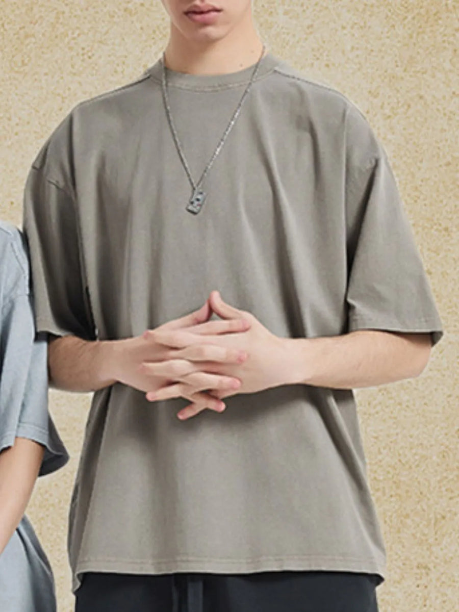 Oversized washed cotton tee in gray with a crew neck and short sleeves.