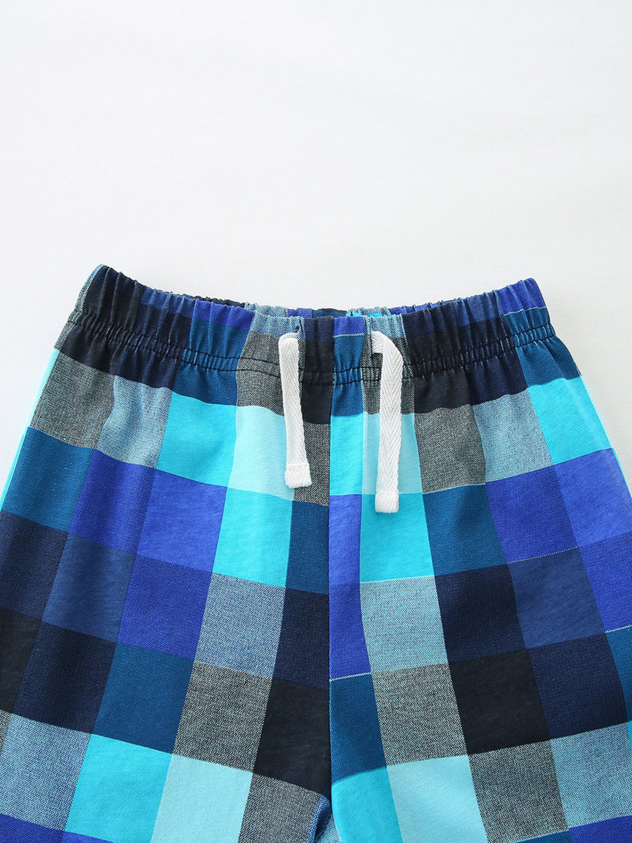 Baby blue plaid shorts with elastic waistband and white drawstring