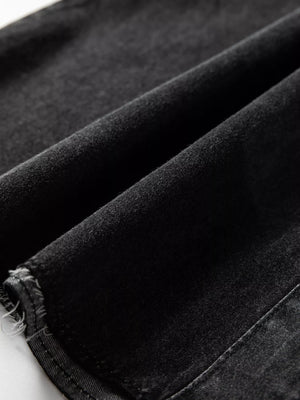 Black denim dress with raw hem detail