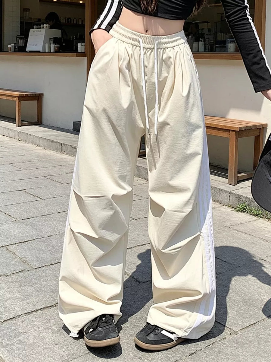 100% polyester Care instructions: Machine wash cold wide-leg pants in Beige with loose silhouette