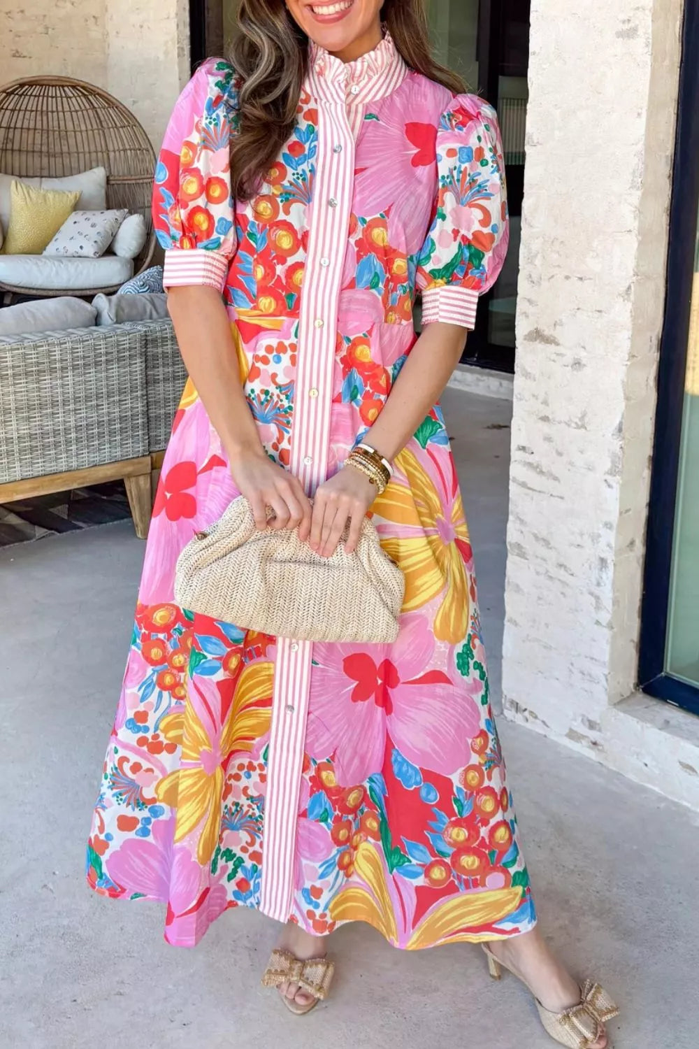 Vibrant floral maxi dress with button front, puff sleeves, and pink stripe detail.