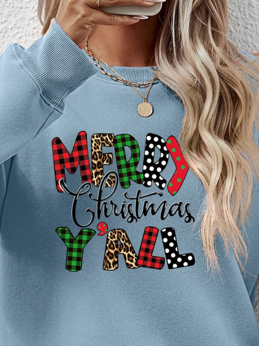 Misty Blue graphic sweatshirt with Merry Christmas Y'all text in mixed prints like plaid, leopard, polka dot.