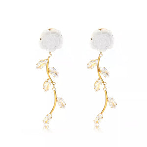 earrings in white with floral and drop design