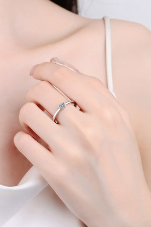 Silver ring with a heart-cut solitaire diamond on a delicate band.