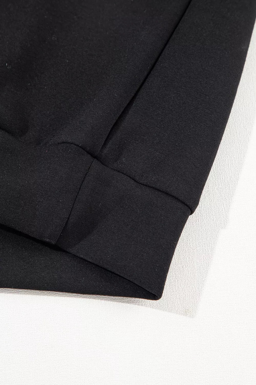 50% polyester, 45% viscose, 5% elastane Care instructions: Machine wash cold sweatshirt and sweatpants set in black with