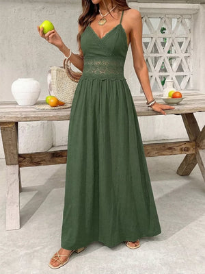 Green cotton blend maxi gown with spaghetti straps, V-neck, lace cinched waist and hem.