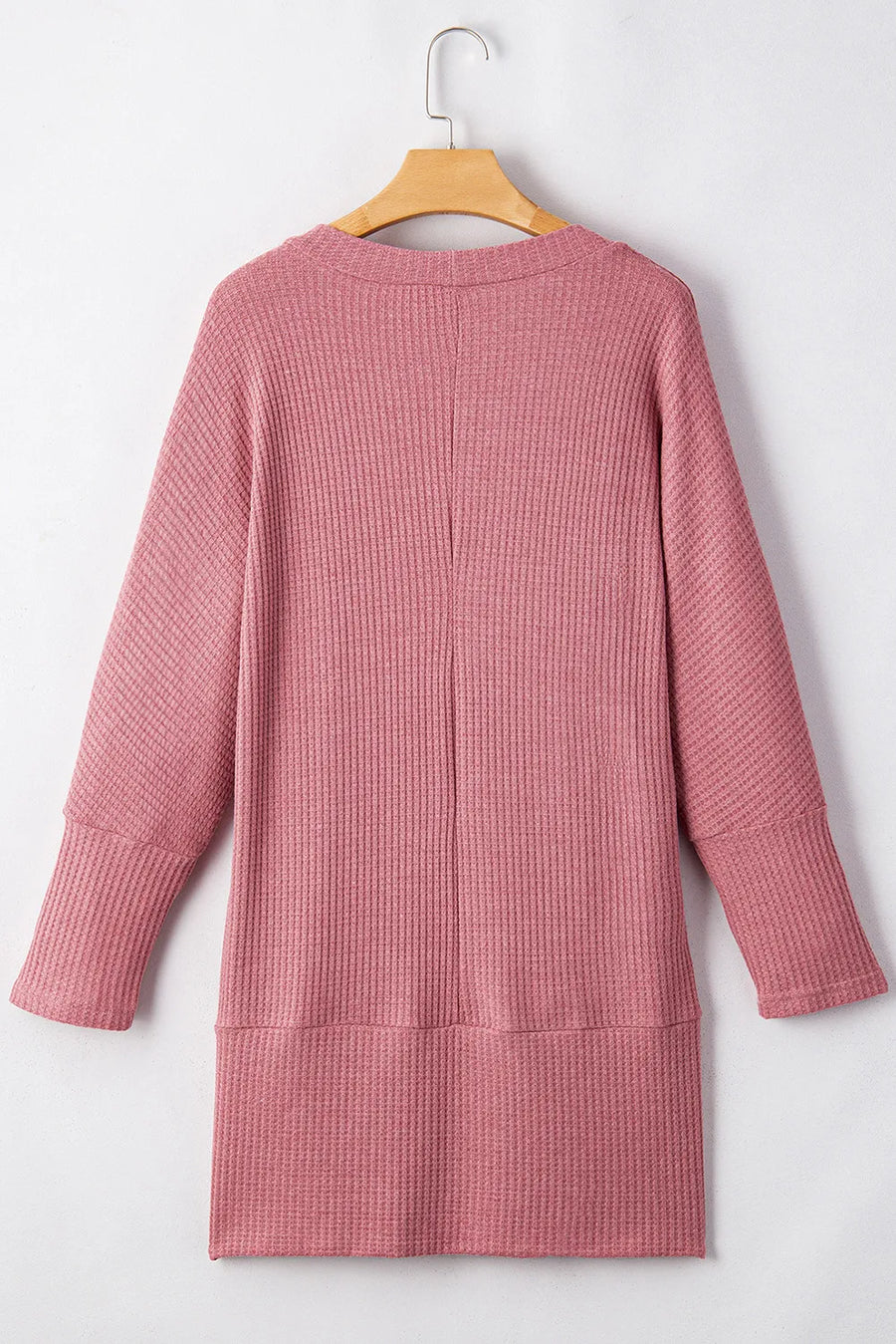 Dusty pink waffle knit open front cardigan with long sleeves and a relaxed fit.