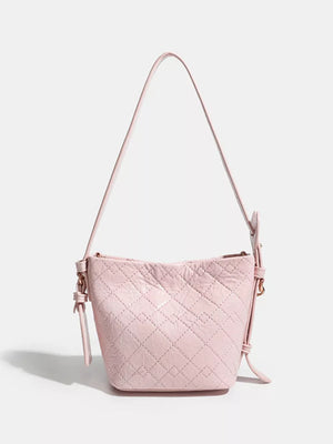 Pink quilted bucket bag with chain accent and adjustable strap