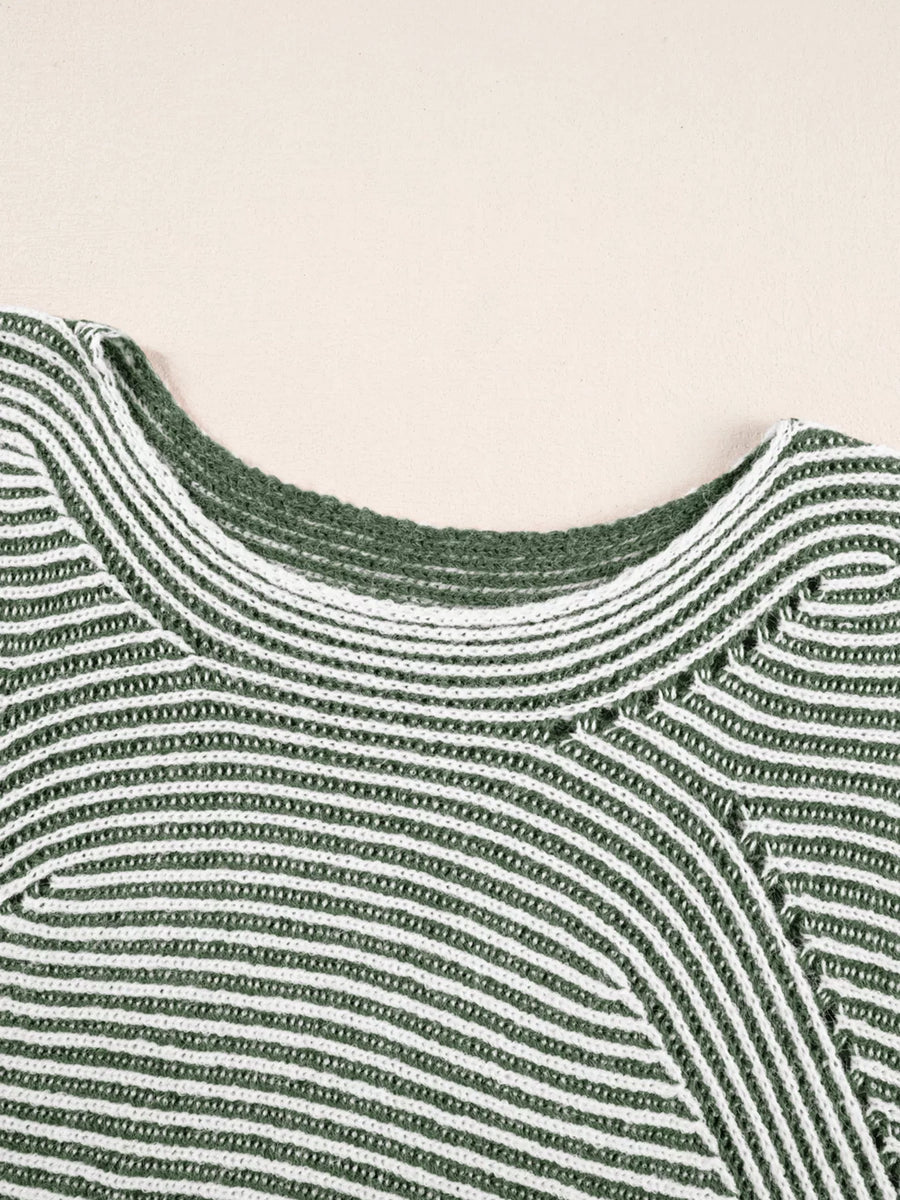 Relaxed ribbed knit sweater with boat neck in stripe pattern.