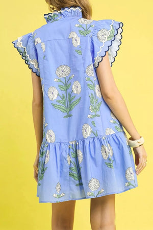 Blue floral cotton mini dress with ruffle sleeves and scalloped trim.