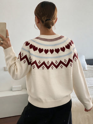 cream crewneck sweater with ribbed cuffs and long sleeve