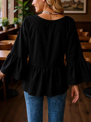 Black v-neck blouse with flounce sleeves and peplum hem