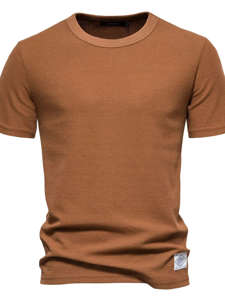 Textured crew-neck t-shirt in Caramel with a waffle knit and a small logo tag.
