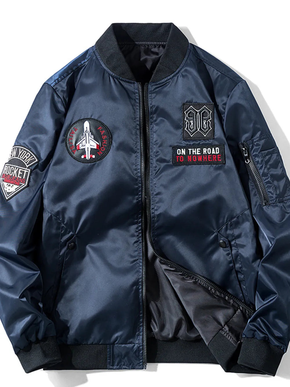 Dark blue bomber jacket with embroidered patches, zip front, and ribbed cuffs.