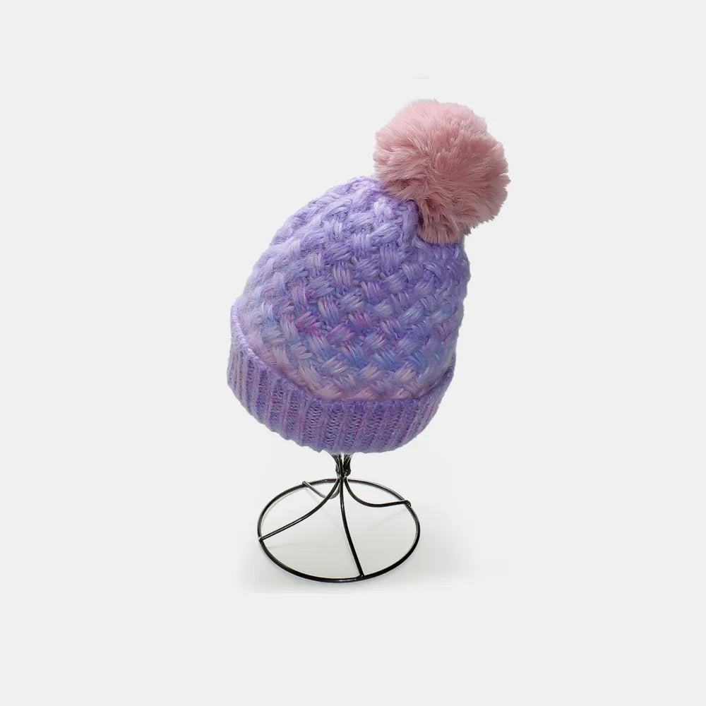 Lavender ombre knit beanie with textured weave and pink pom pom.