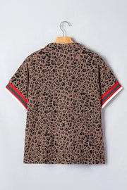 Brown leopard jacquard half-zip shirt with striped sleeve cuffs.
