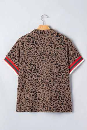 Brown leopard jacquard half-zip shirt with striped sleeve cuffs.