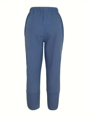 Relaxed fit wide-leg pants in peacock blue with elastic waist and cuffed hems.