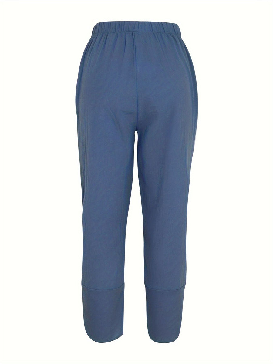 Relaxed fit wide-leg pants in peacock blue with elastic waist and cuffed hems.