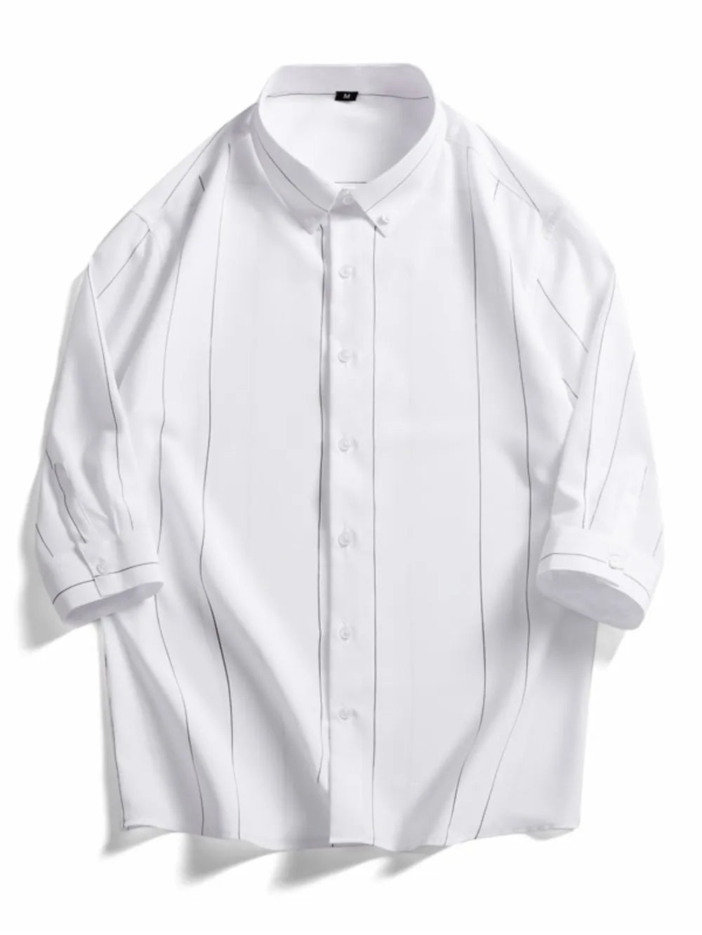 White oversized cotton button-down shirt with pinstripe pattern and button cuffs.