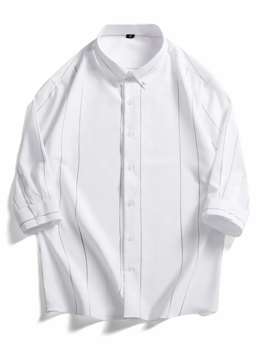 White oversized cotton button-down shirt with pinstripe pattern and button cuffs.