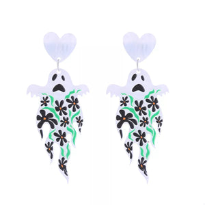 Spooky ghost dangle earrings with black flowers and green vines, acrylic material.