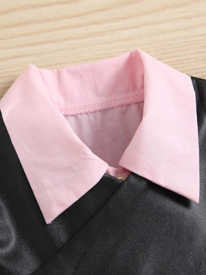 Toddler button front dress and vest set with pink collar and black faux leather.