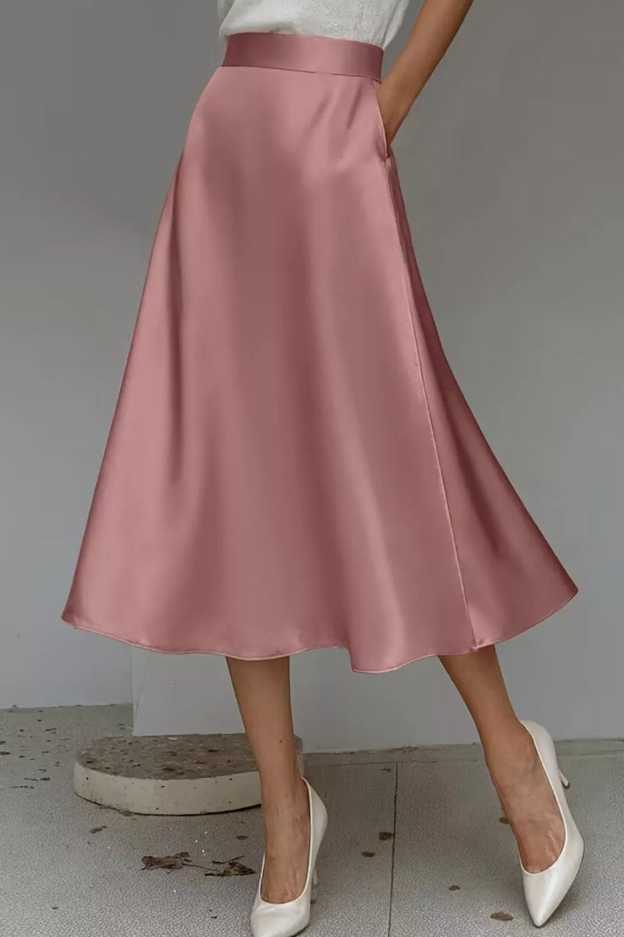 Dusty Pink a-line midi skirt with hidden pockets and a lustrous finish.