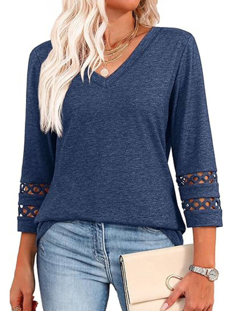 Blue 3/4 sleeve t-shirt with V-neck and cutout detail on sleeves.