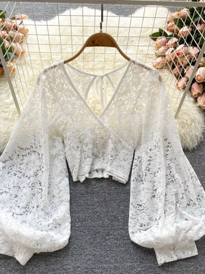 White sheer floral lace cropped shirt with balloon sleeves and tie-back detail.