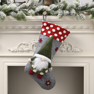 Gray holiday stocking with red polka dot cuff, gnome applique, and snowflake details.