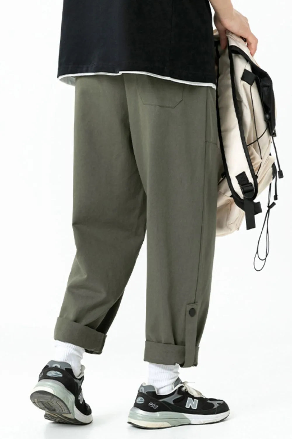 Relaxed fit cuffed cargo trousers in Army Green with button details and a casual cut.