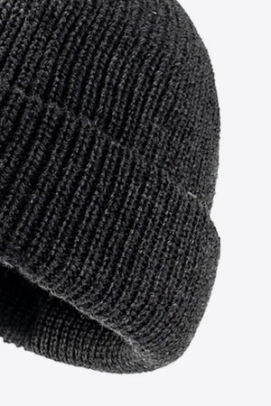 Black ribbed knit beanie with folded edge detail