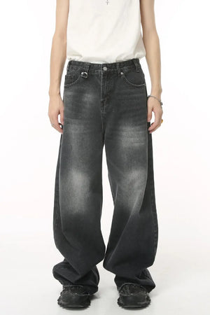 Oversized wash denim jeans in charcoal grey with a baggy fit.