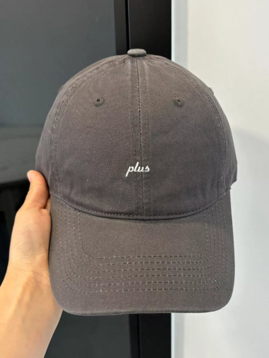 Grey baseball cap with white embroidered "plus" detail